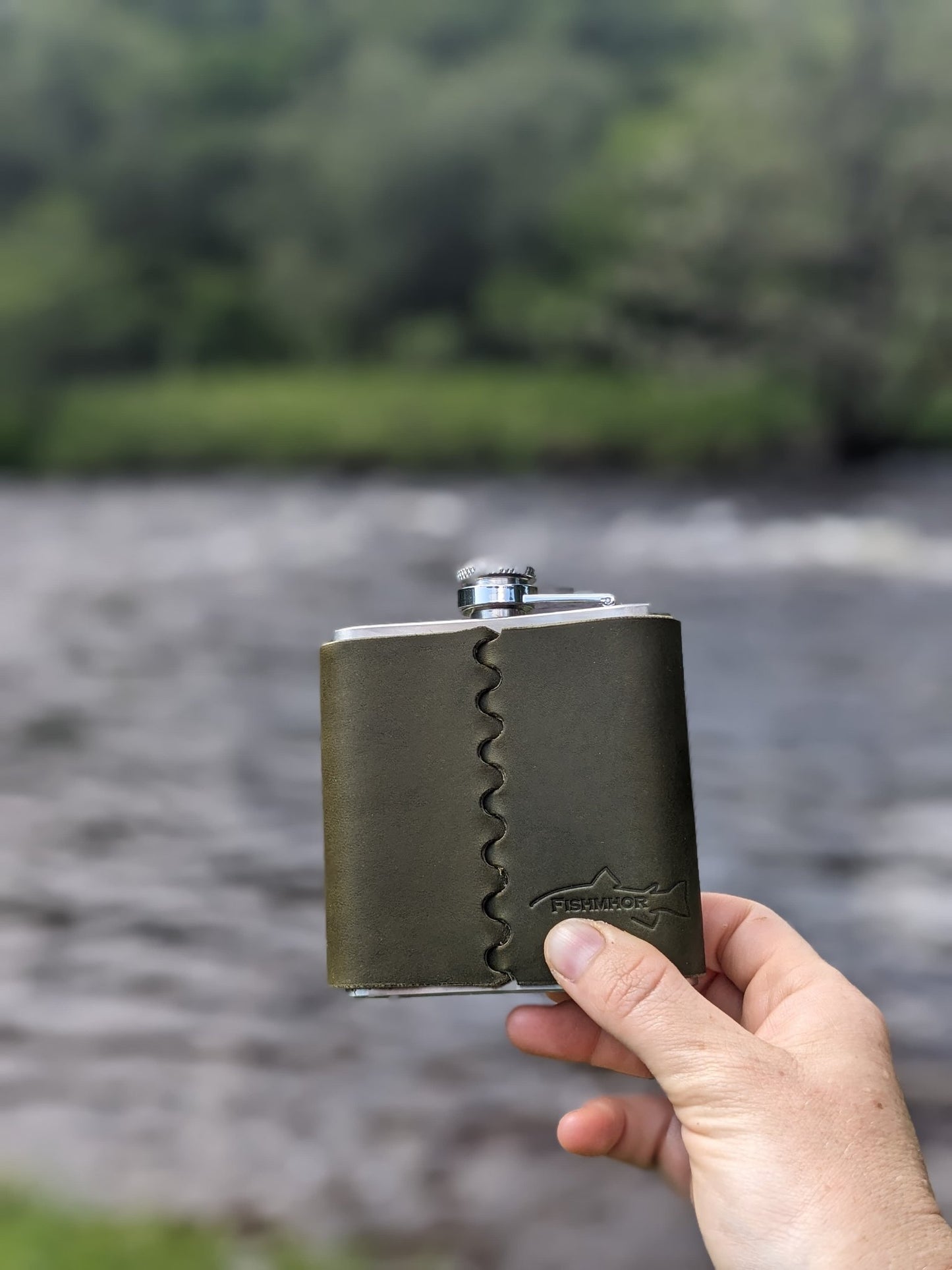 65538f7a329f1a3a70a34bd9_back-of-blue-hipflask-salmon-1_1760089802227.jpg