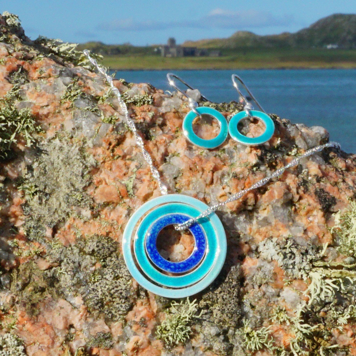65538f7a329f1a3a70a34bd9_iona-blues-pendant-earrings_1793026821922.jpg