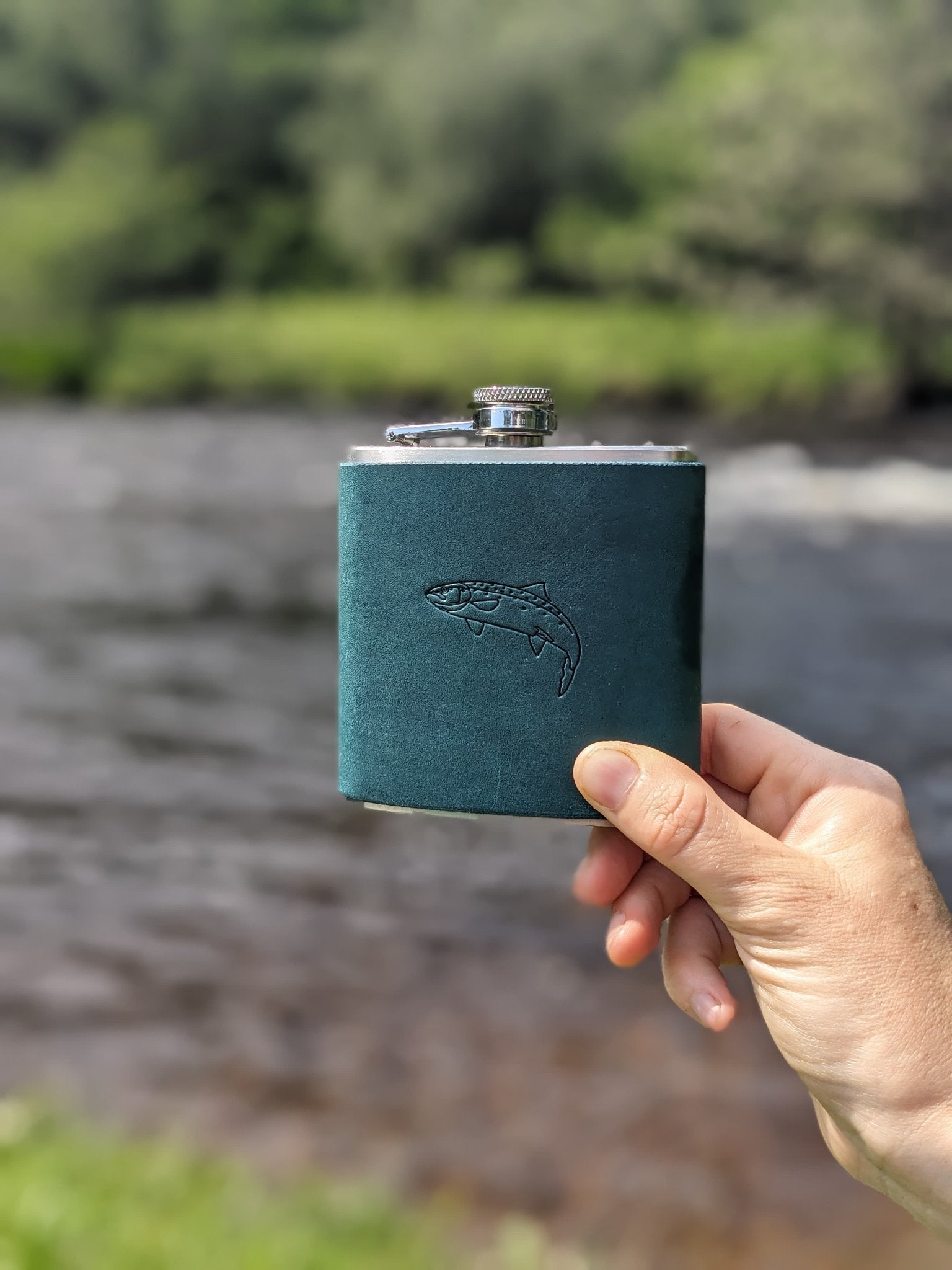 65538f7a329f1a3a70a34bd9_portrait-blue-hipflask-salmon-1_1760089856104.jpg