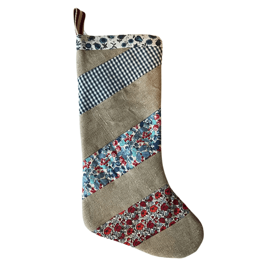 Handmade patchwork Christmas stocking made with linen and cotton.